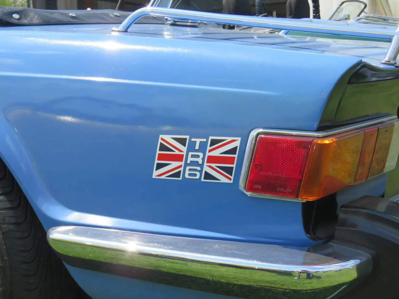A close up of the rear end of an old car