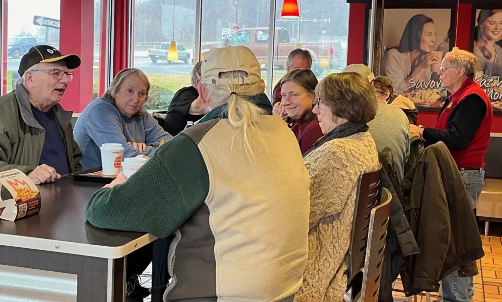 Group of people dining in a restaurant.